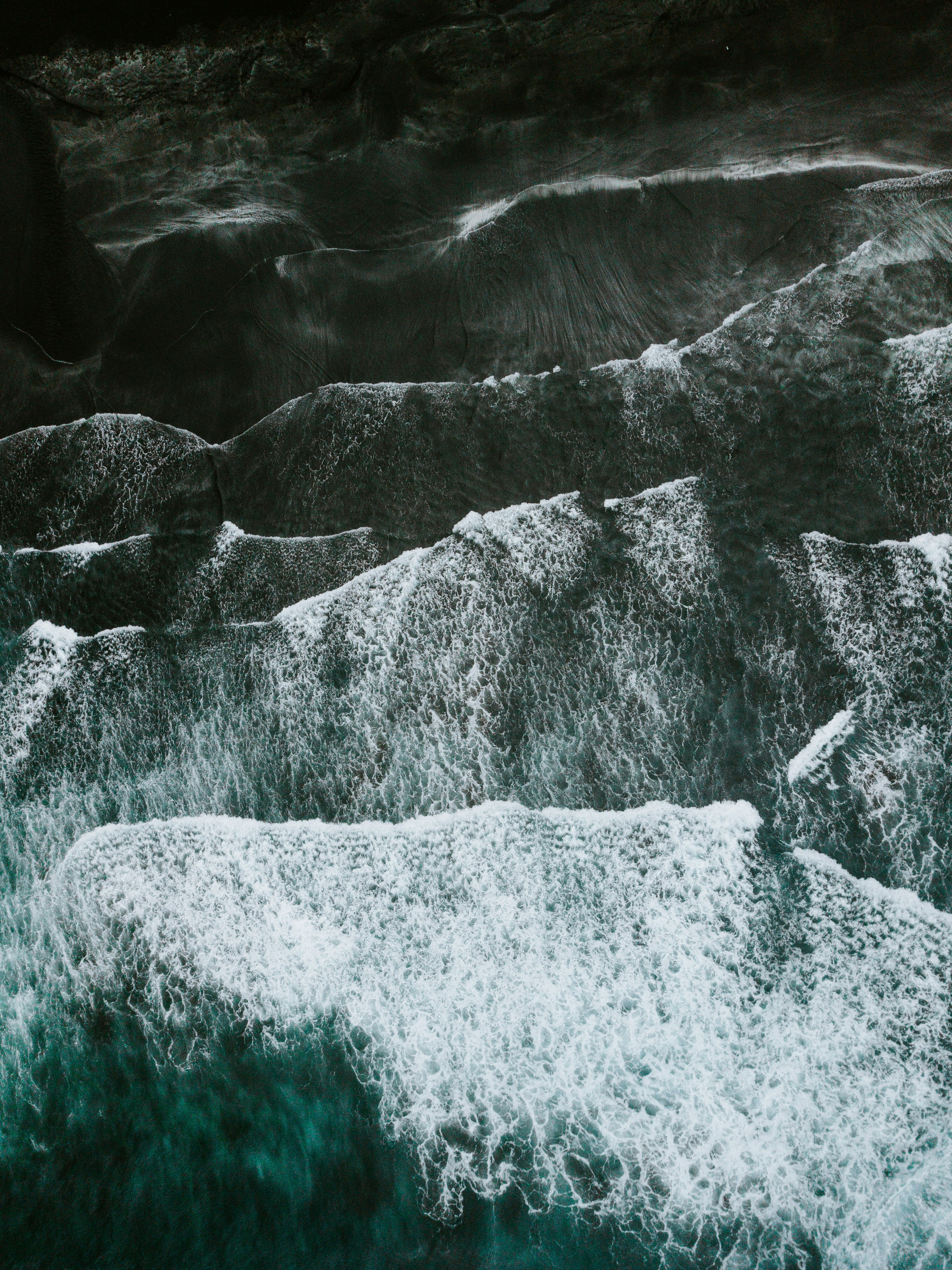 sea waves crashing in shore